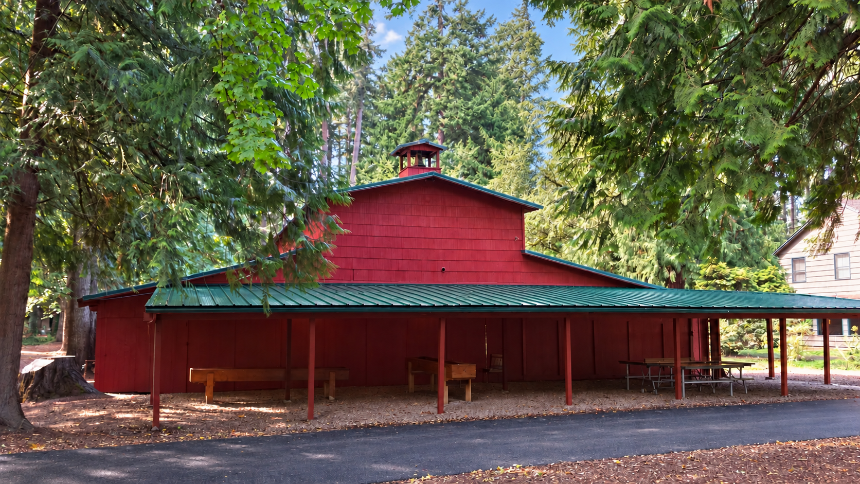 The historic Tabernacle with a glossy green front overhang and newly paved path